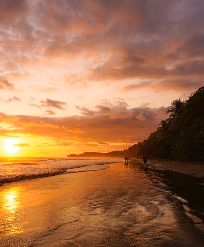The sun sets in orange hues over the sea in Costa Rica