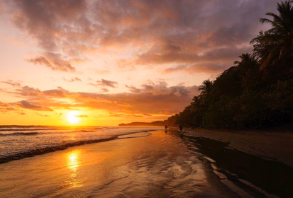 The sun sets over the water in Costa Rica