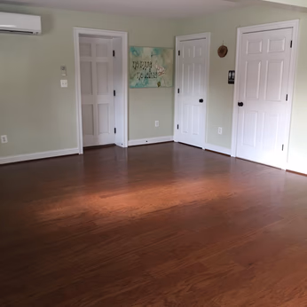 High shot of the Sykesville yoga studio, with green walls and white doors. 